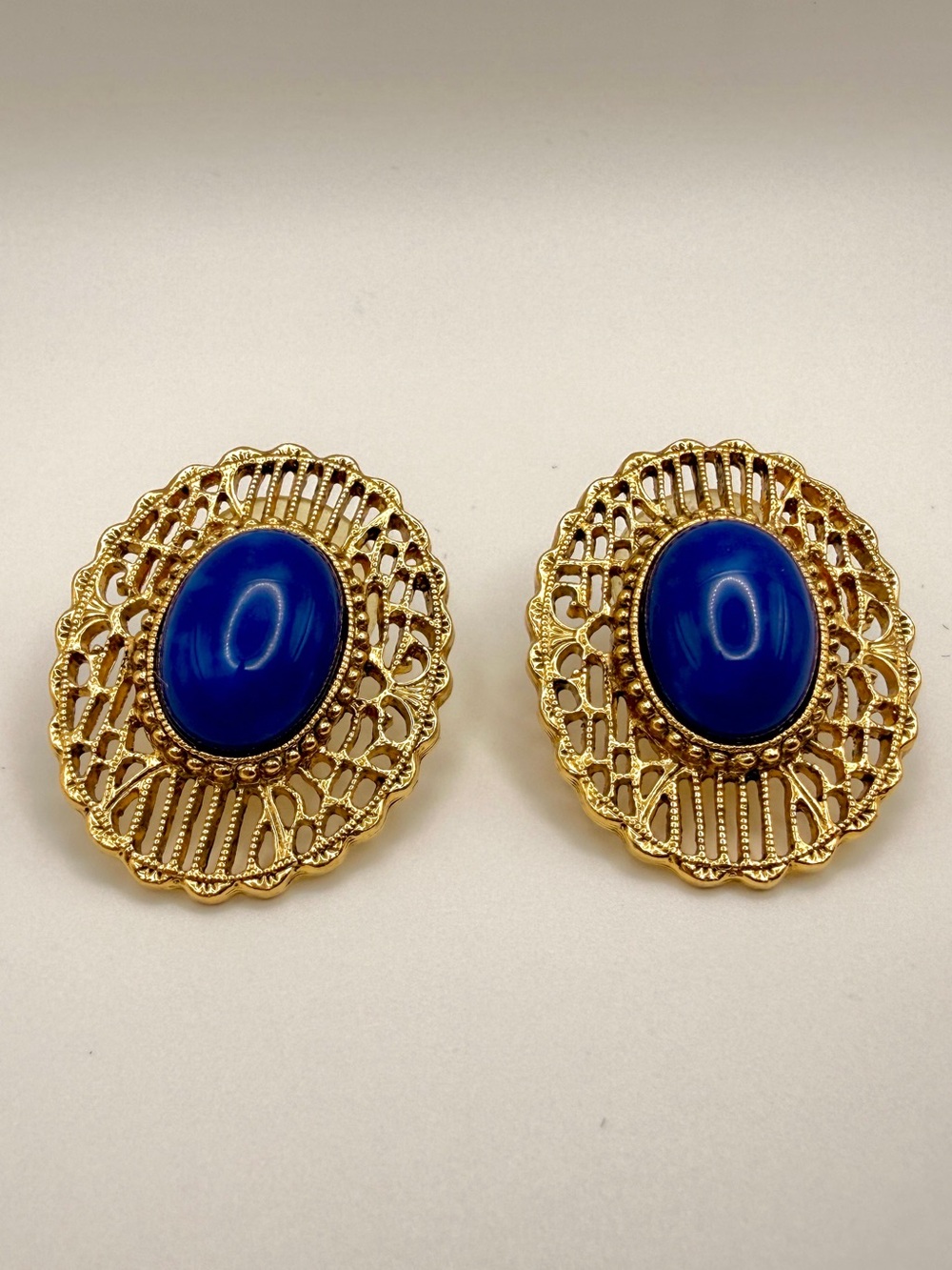 Vintage Gold Tone Filigree Oval Post Back Earrings with Blue Cabochon
